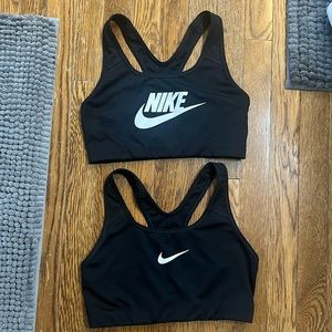Two black Nike sports bras